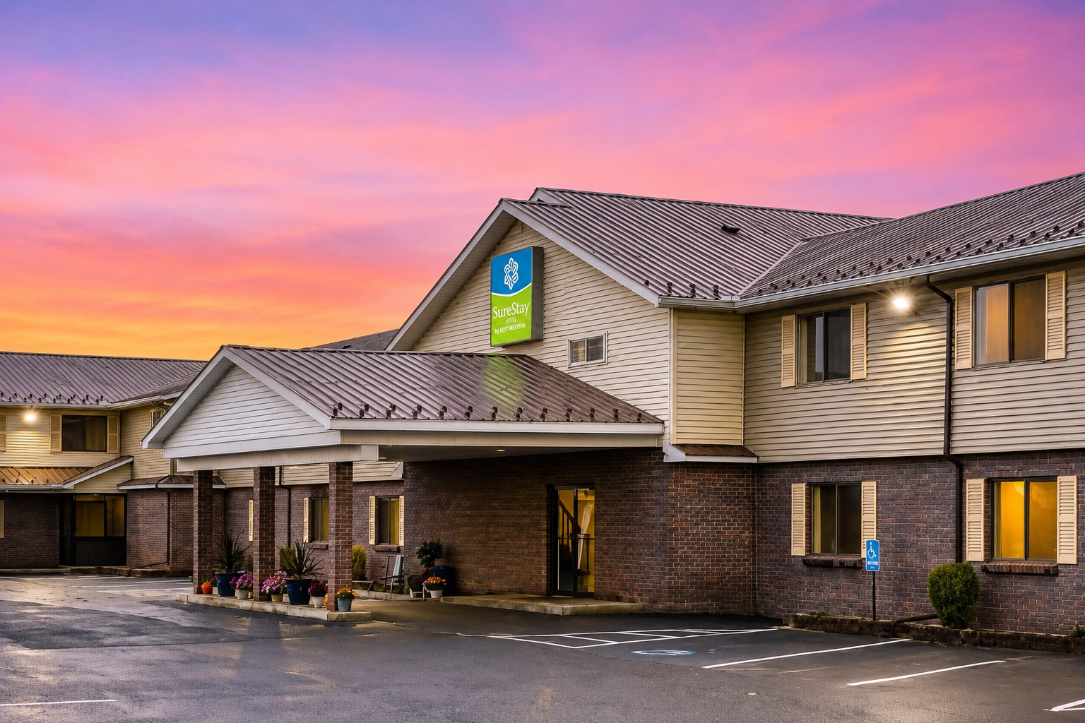 SureStay by Best Western Massena exterior at sunset